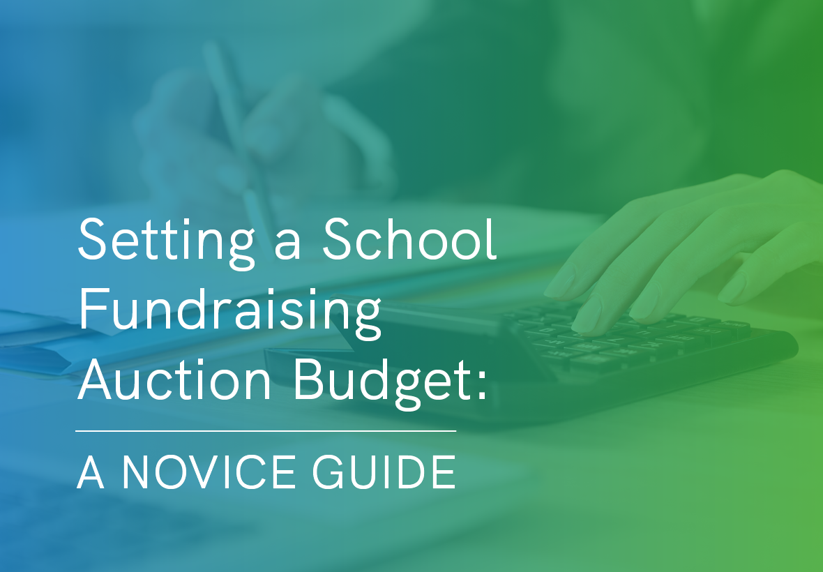 A fundraiser uses a calculator to determine their school’s upcoming auction budget.